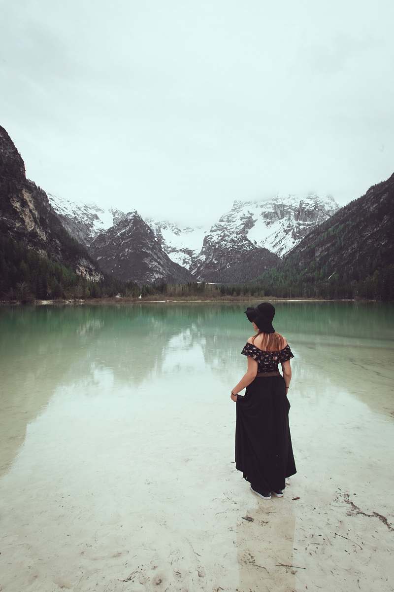 clothing woman standing on calm body of water apparel